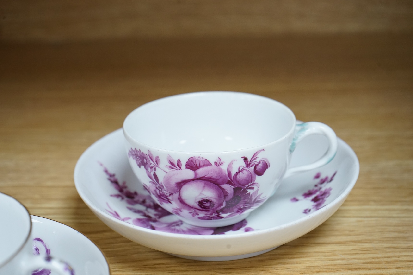 Two 18th century Meissen floral decorated teacups and saucers, largest saucer 13.5cm diameter